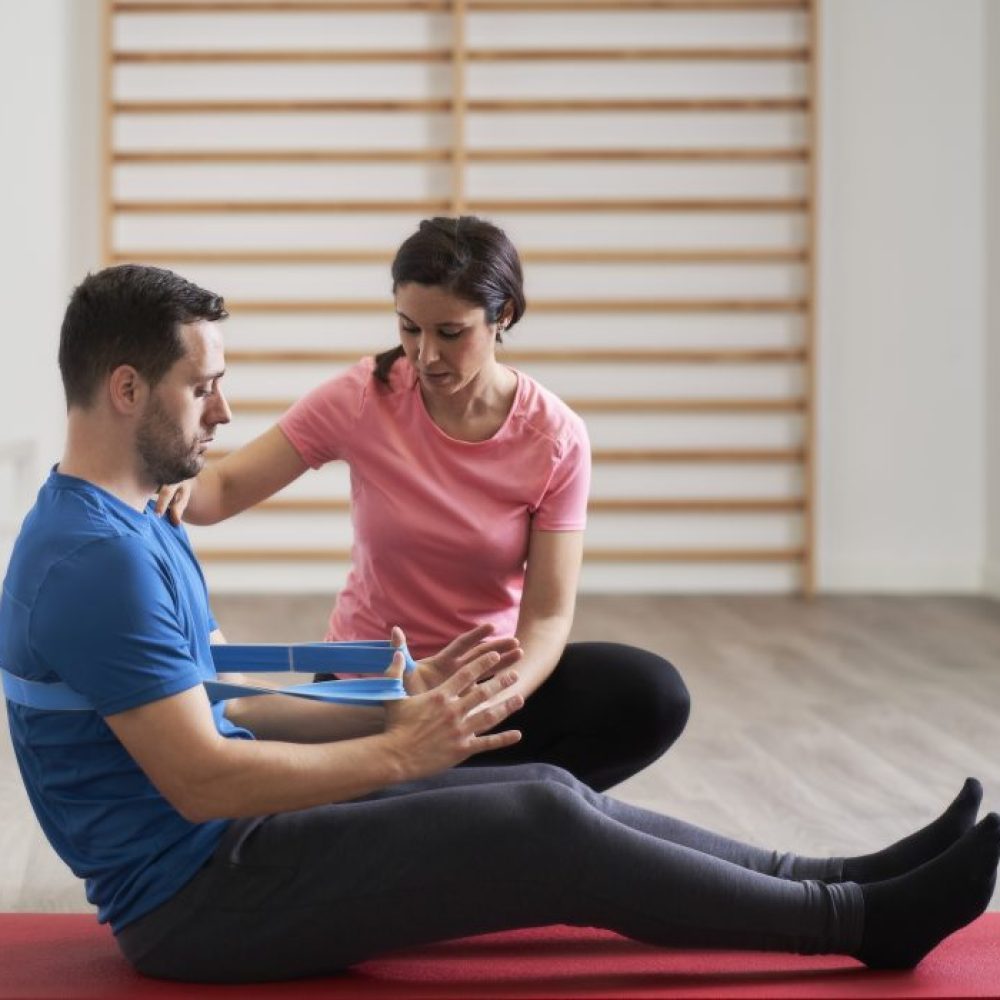 a-young-woman-instructing-a-man-on-the-correct-pos-2024-12-02-16-43-09-utc-r9fbfh1i3bca1g098mu6gxw2qdz63ktlv6scodyjq0